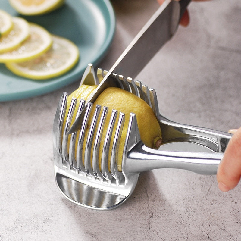 Handheld slicing guide holding a lemon while a knife cuts through the slots