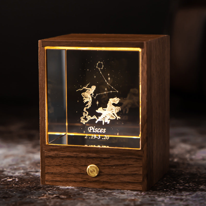 Lit Pisces crystal night light with engraved figure and constellation in a walnut base