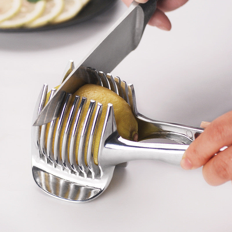 Knife slicing a lemon held in the silver slicing guide