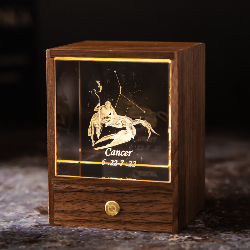 Lit Cancer crystal night light with engraved figure and constellation in a walnut base